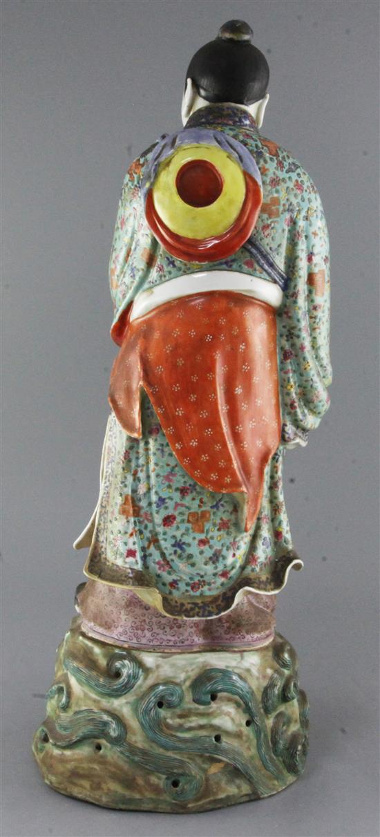 A large Chinese famille rose figure holding a flute, late 19th century